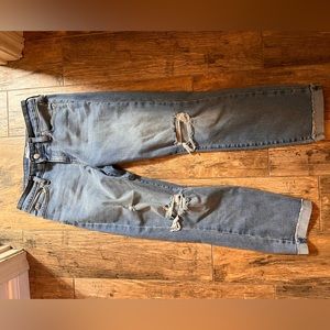 Denizen from Levi’s boyfriend blue jeans with holes in the knees. Size 2.